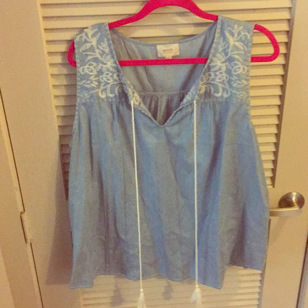 Chambray top with embroidered detail and tassels